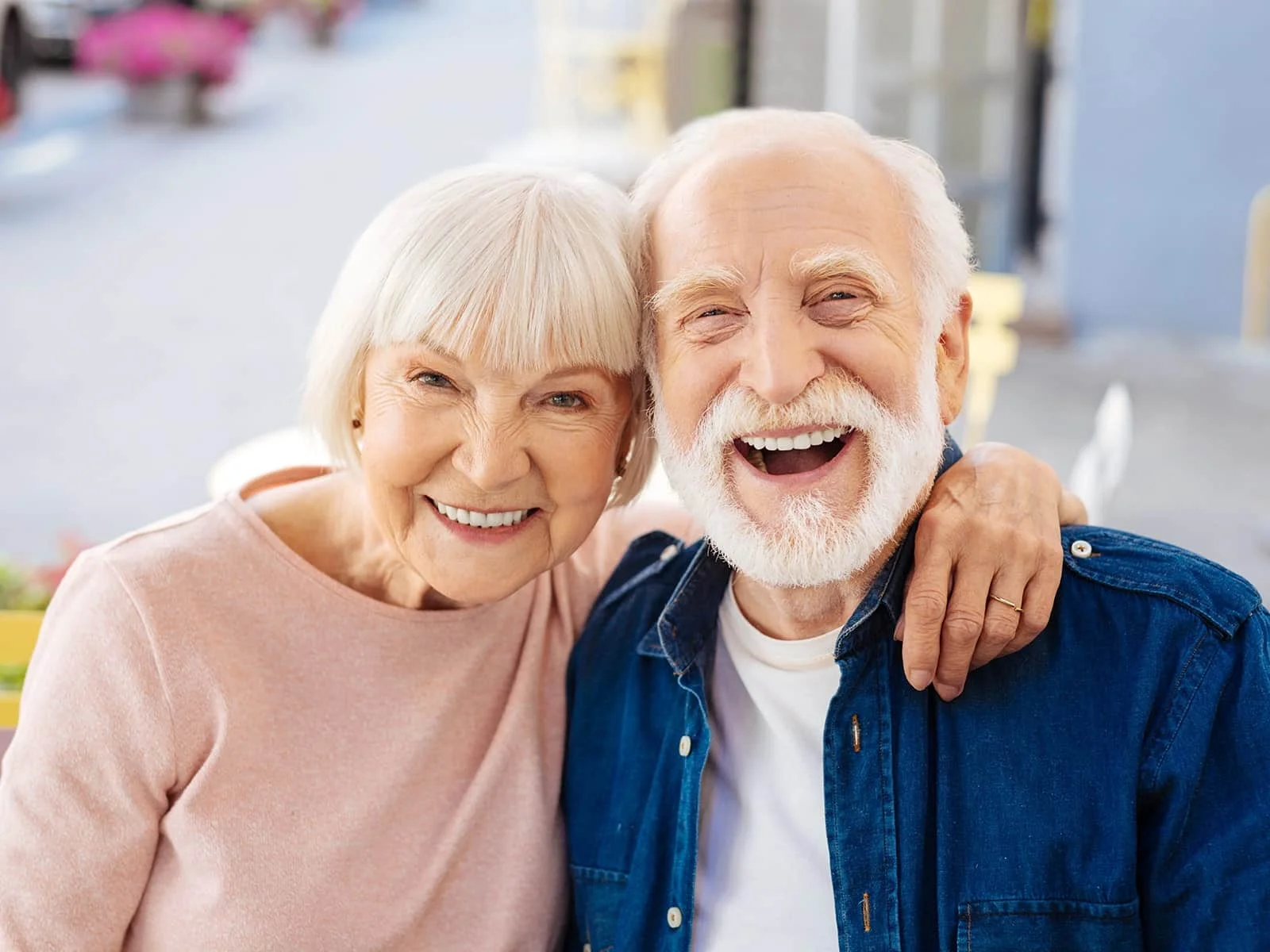 Elderly-couple-smiling-on-their-back-patio by Hill Dental Acquisitions LLC, DBA Smile On Dental Studio in Richmond Heights, MO