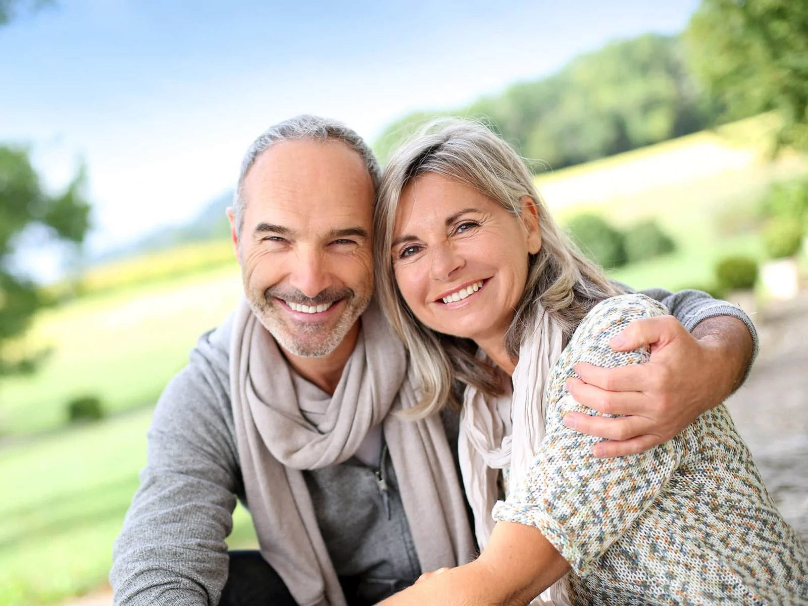 Mature-couple-smiling-outside by Hill Dental Acquisitions LLC, DBA Smile On Dental Studio in Richmond Heights, MO