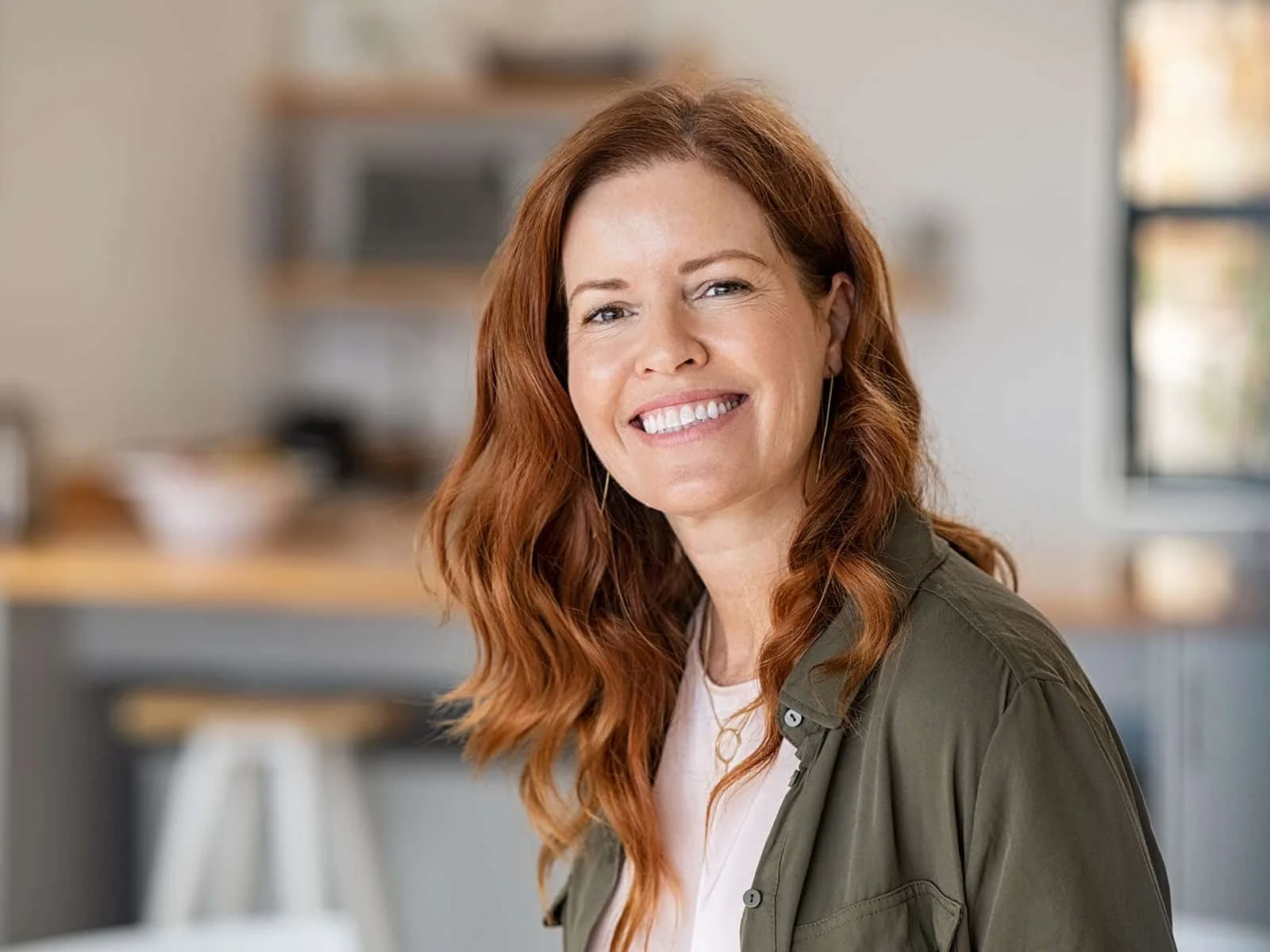 Woman-with-red-hair-smiling by Hill Dental Acquisitions LLC, DBA Smile On Dental Studio in Richmond Heights, MO