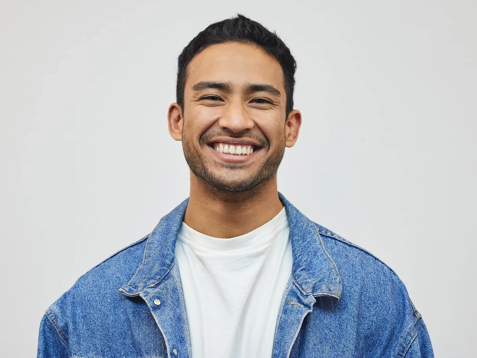 Young-man-smiling-wearing-a-jean-jacket by Hill Dental Acquisitions LLC, DBA Smile On Dental Studio in Richmond Heights, MO